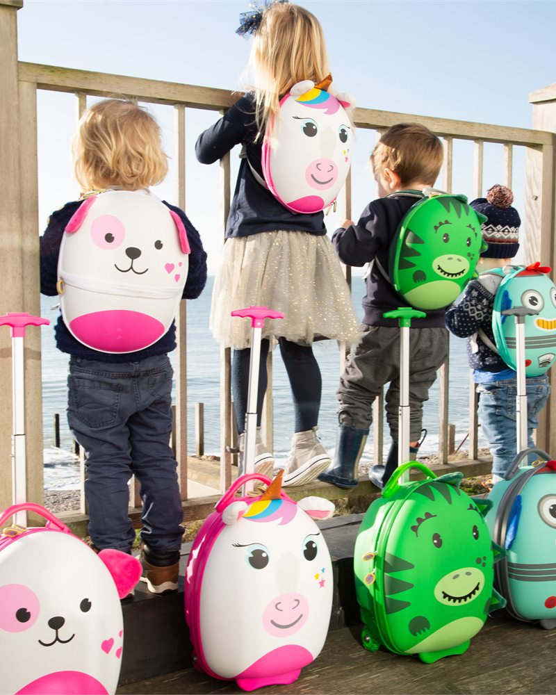 Children with boppi Tiny Trekker character luggage